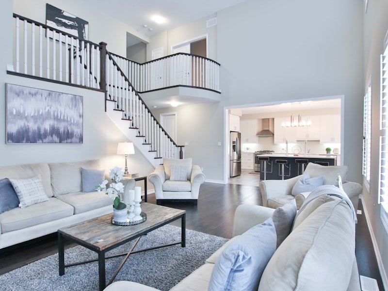 A finished staircase with white spindles and stained oak handrail in an Ottawa home